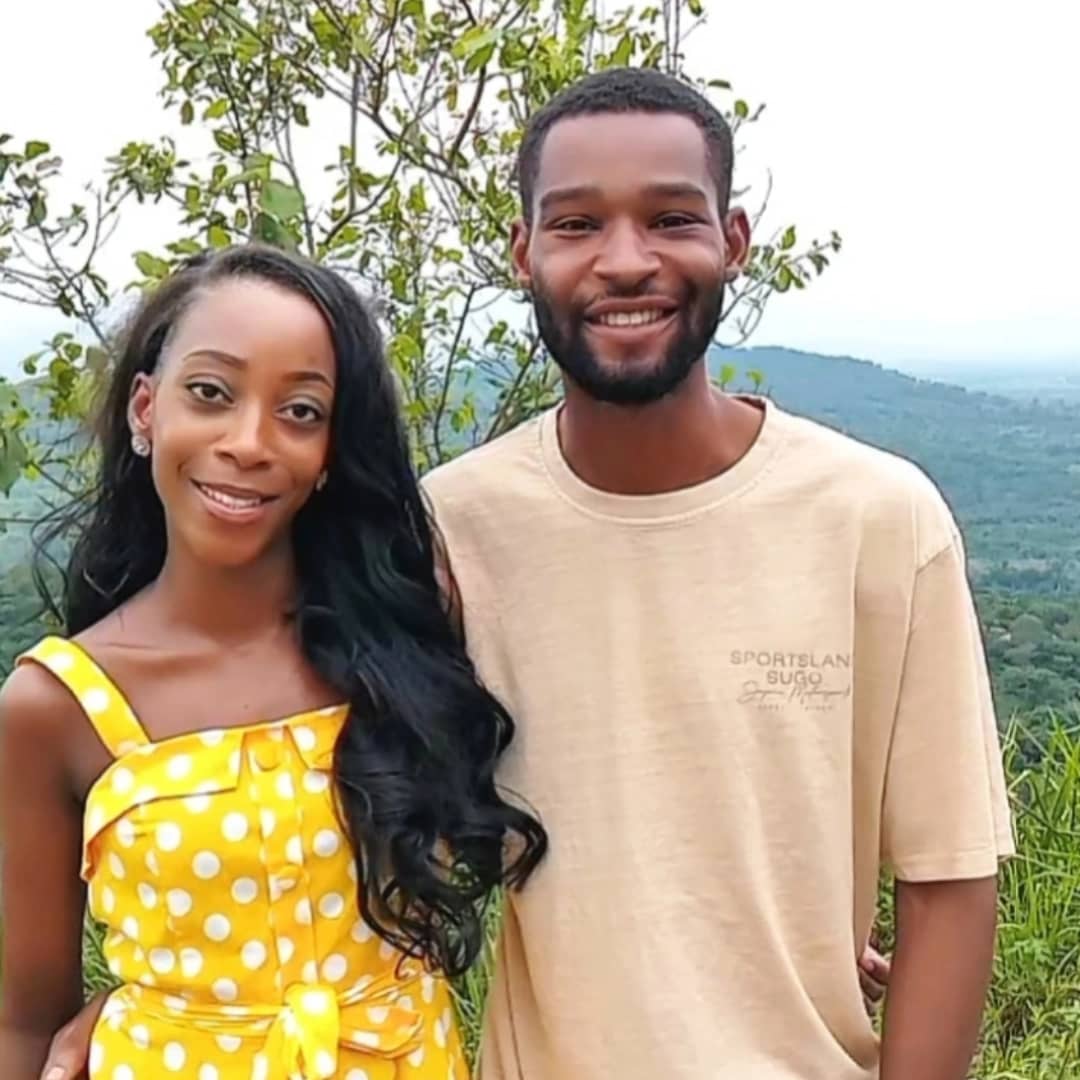 The founders of Ubuntu Eco Gardens standing together overlooking the Adaklu landscape
