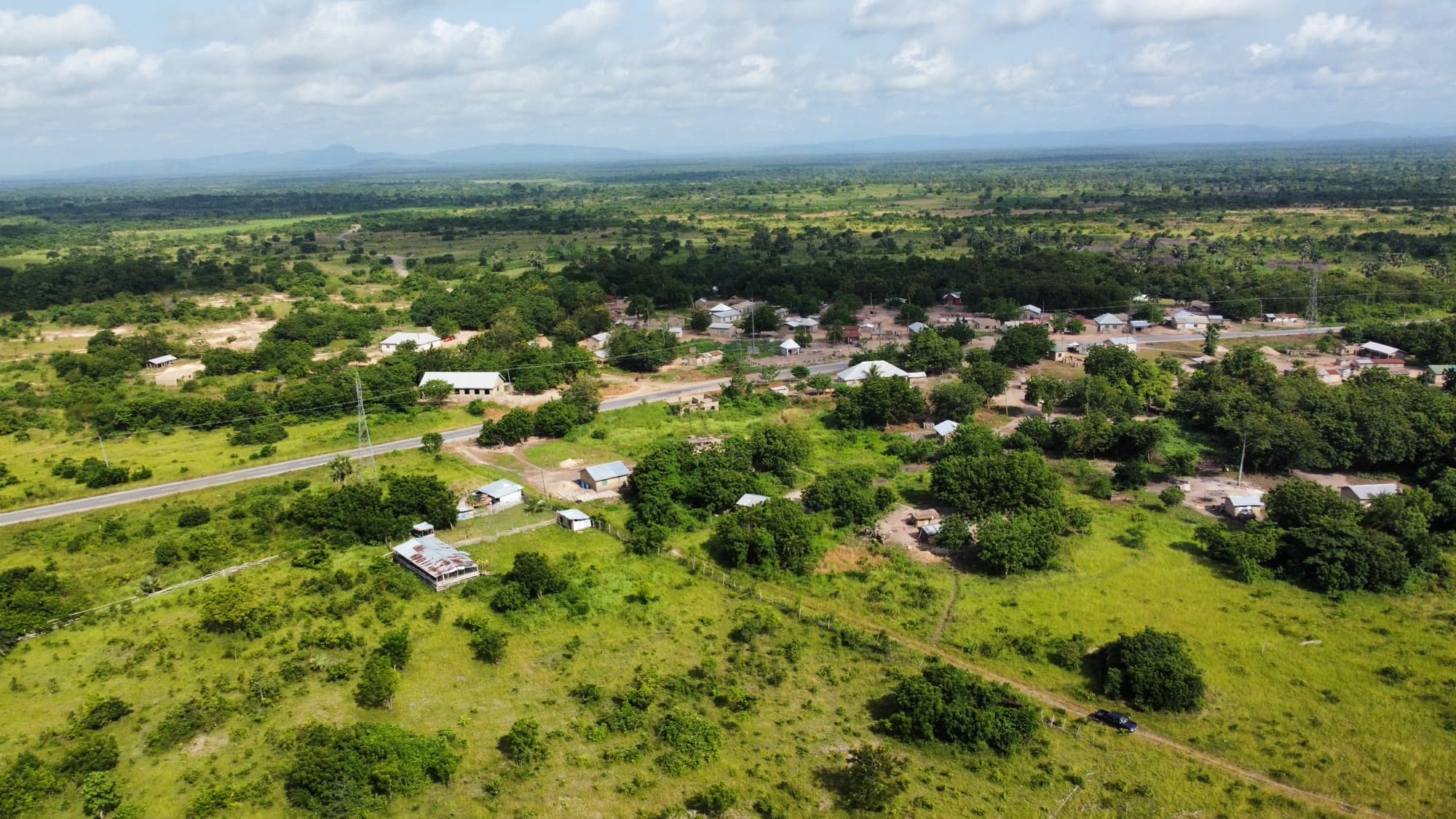 Aerial drone photo of the road and village bordering the Ubuntu Eco Gardens site